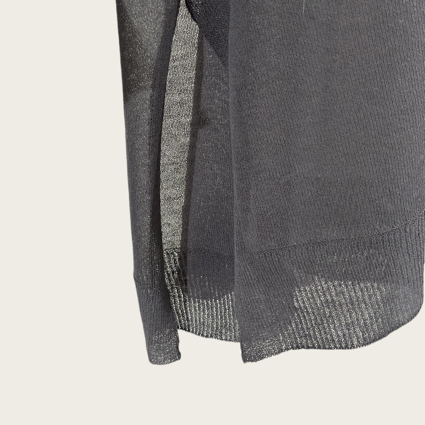 Semi-sheer crew neck pullover knit top with a slightly longer fit.
