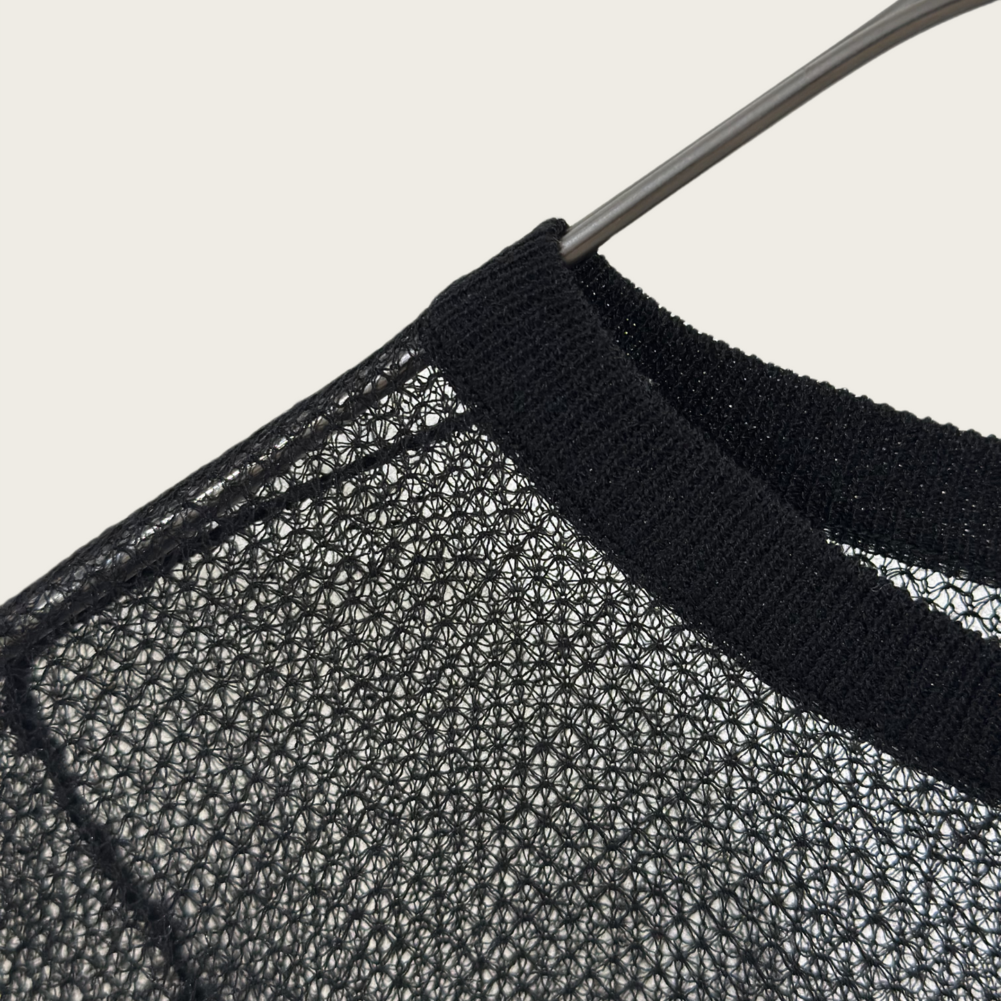 14-gauge knit pullover with drawstring knit details on both sides