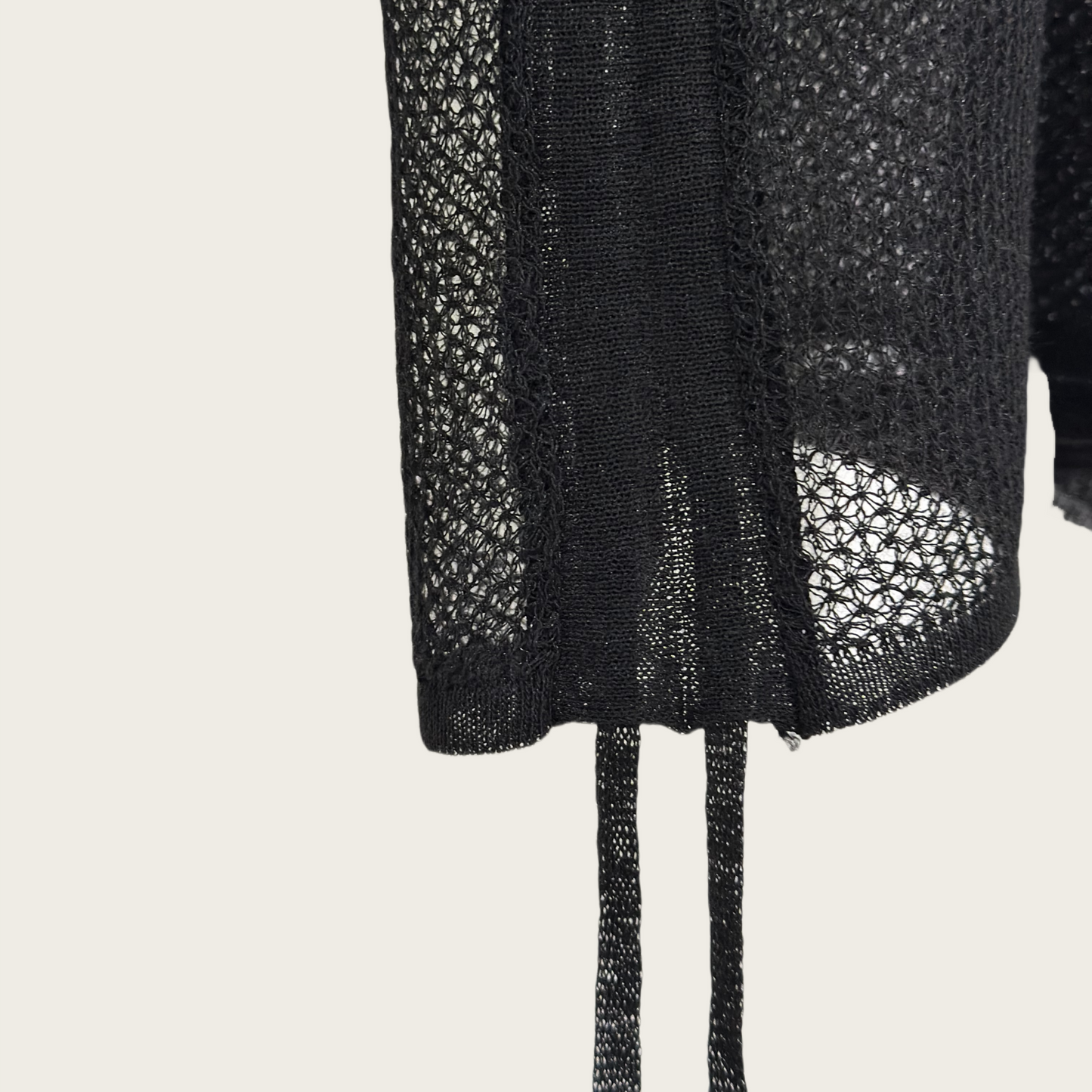 14-gauge knit pullover with drawstring knit details on both sides