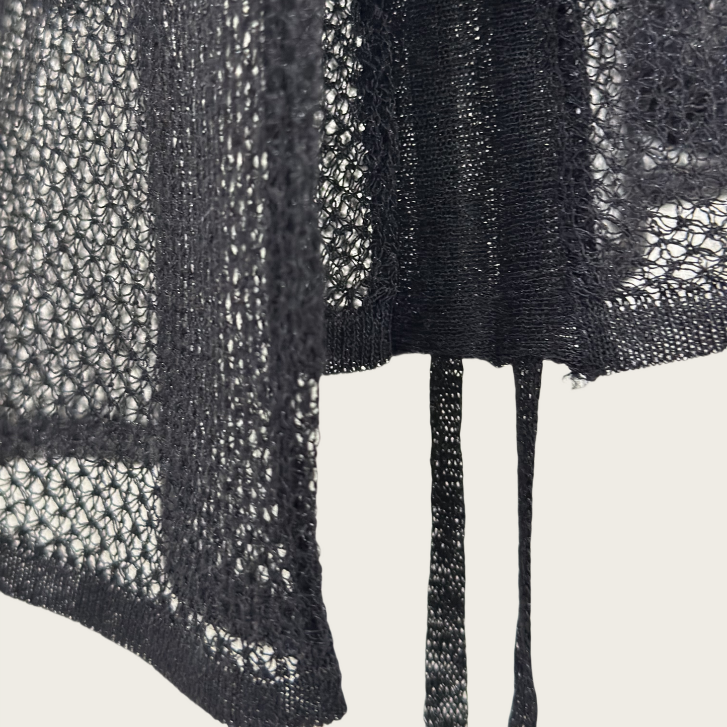 14-gauge knit pullover with drawstring knit details on both sides