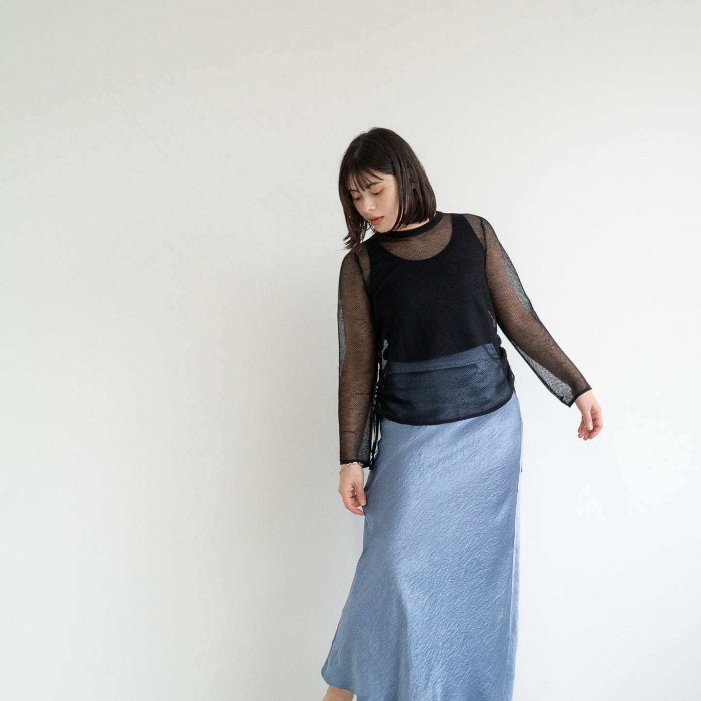 14-gauge knit pullover with drawstring knit details on both sides