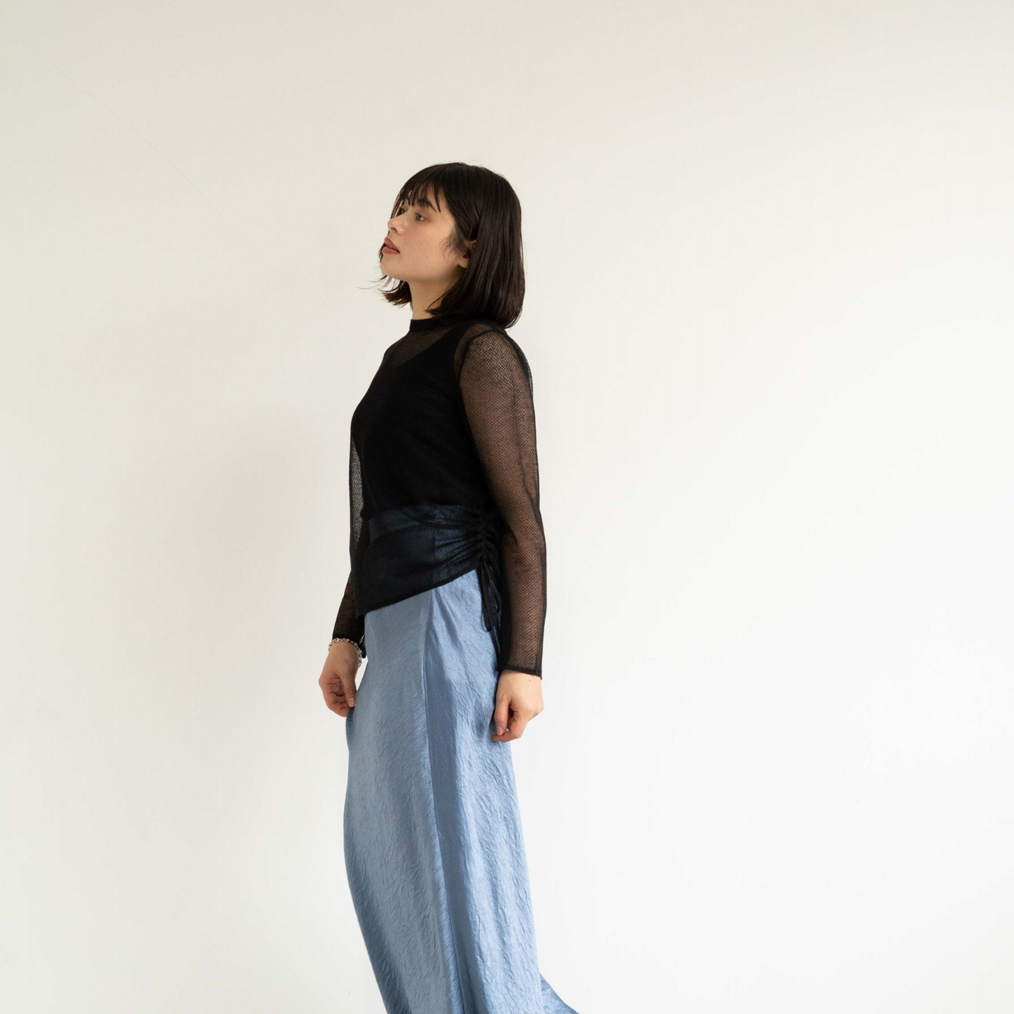 14-gauge knit pullover with drawstring knit details on both sides