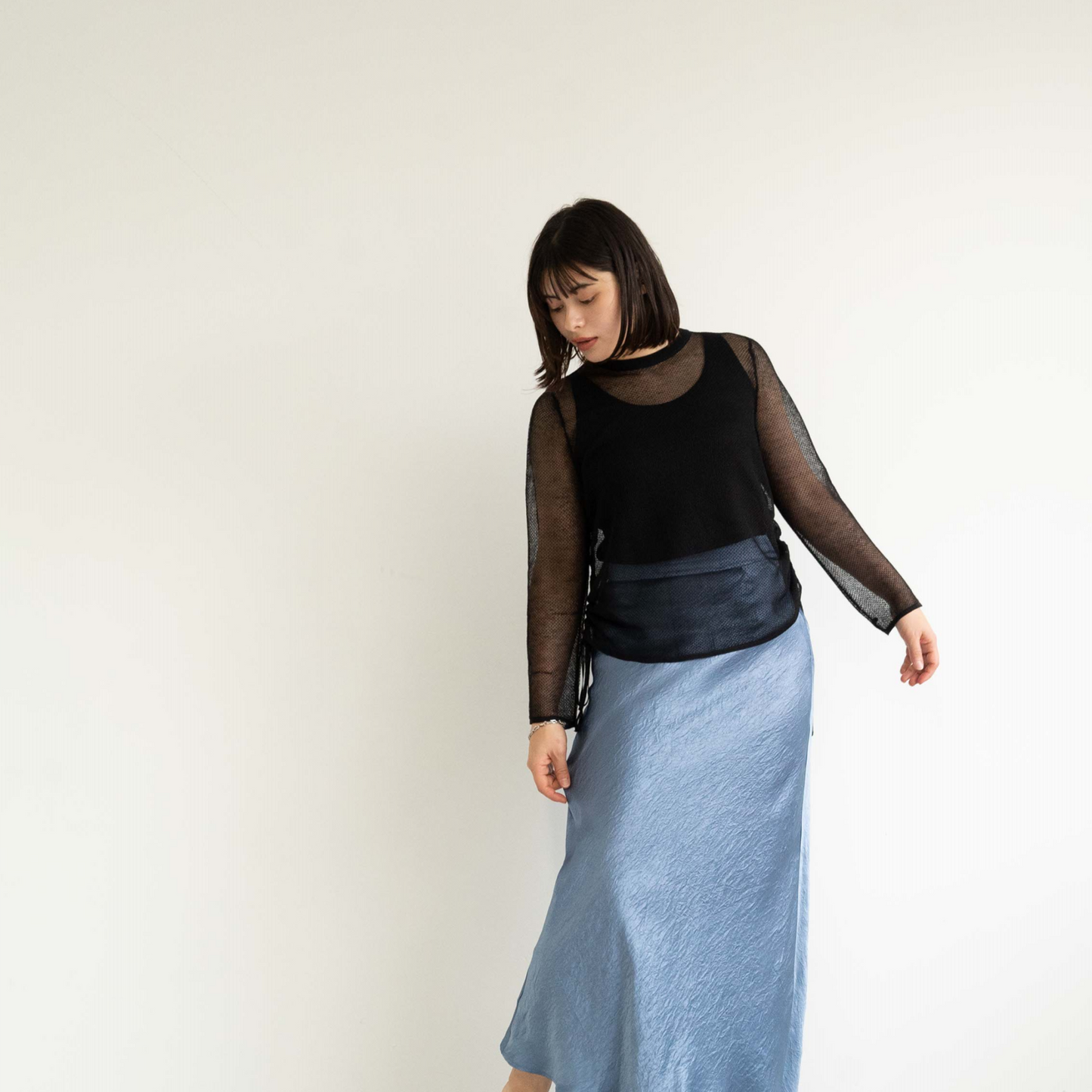 14-gauge knit pullover with drawstring knit details on both sides