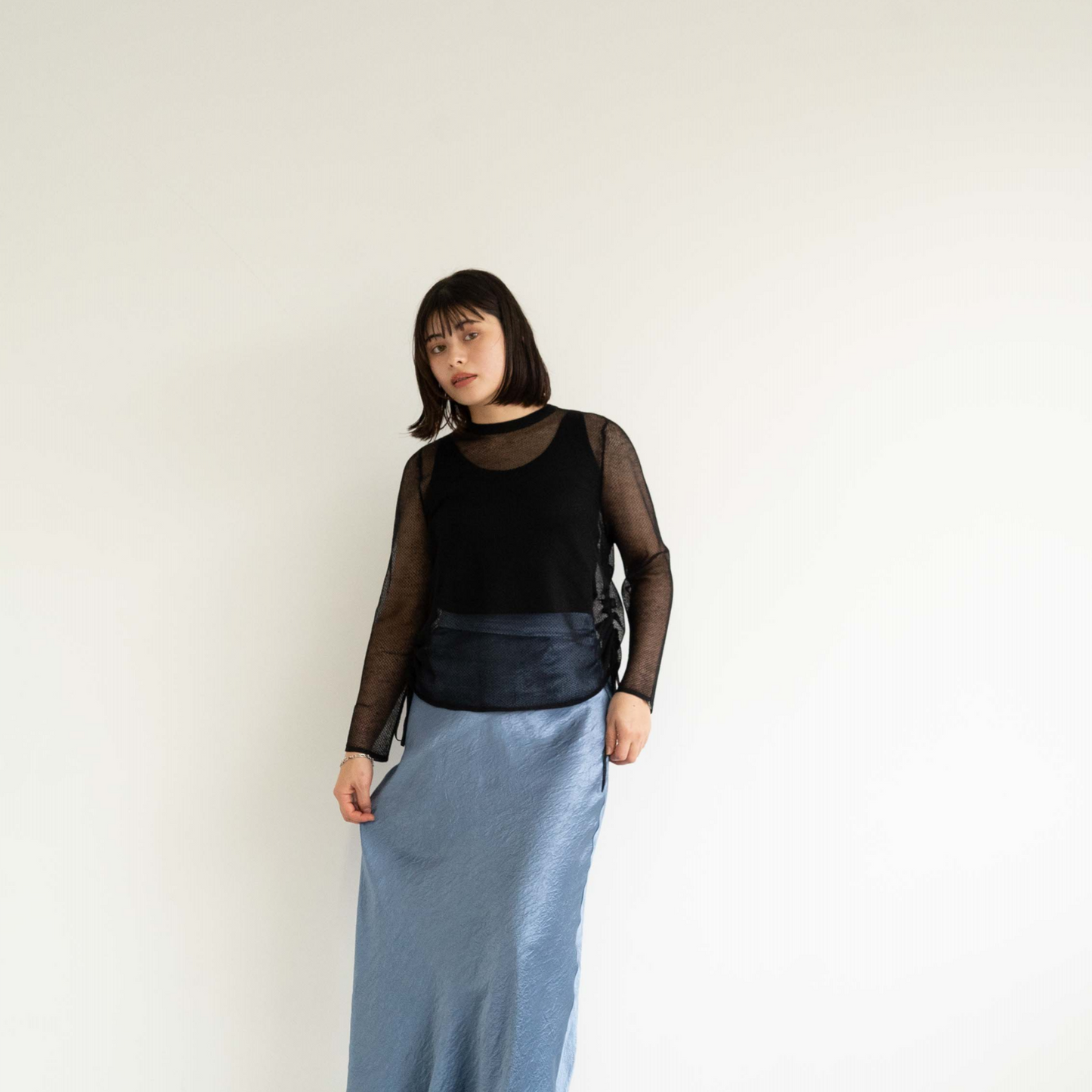 14-gauge knit pullover with drawstring knit details on both sides